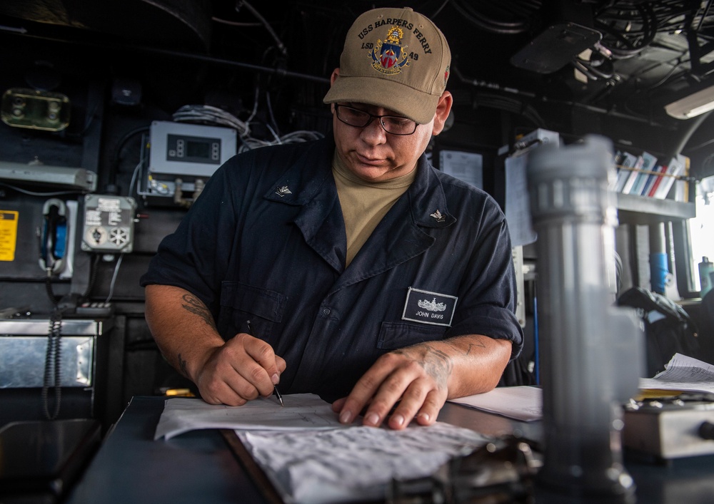 Sailor aboard USS Harpers Ferry Stands Watch