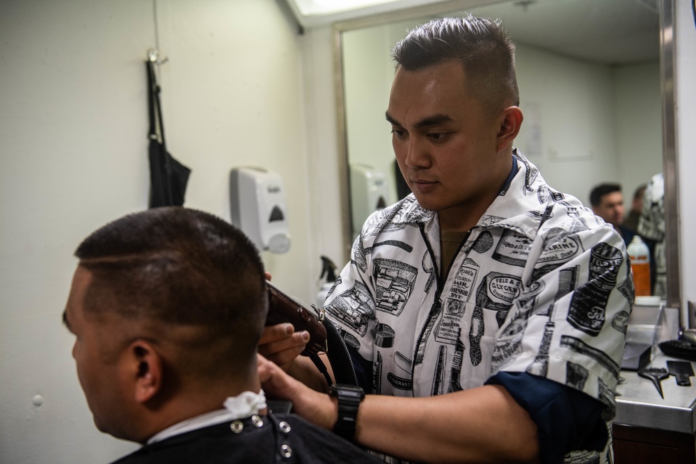 Sailor Cuts Hair aboard USS Harpers Ferry