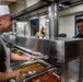 Sailors Serve Dinner Aboard USS Harpers Ferry