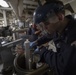 Engineman 2nd Class Joshua Hohn replaces reverse osmosis filters aboard the Arleigh Burke-class guided-missile destroyer USS Momsen (DDG 92).