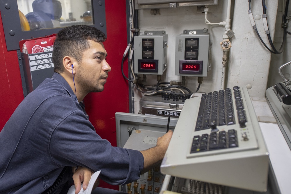 Gas Turbine Systems Technician Electrical 2nd Class Alvaro Rodriguez performs maintenance on the shaft control unit aboard the Arleigh Burke-class guided-missile destroyer USS Momsen (DDG 92).