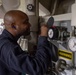 Machinist's Mate Fireman Jose Colon checks gauges inside the main engine room aboard the Arleigh Burke-class guided-missile destroyer USS Momsen (DDG 92).