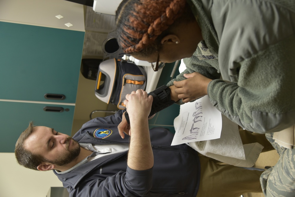 A WRNMMC OT works with an Air Force patient