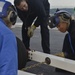 Nimitz Sailors Hitch a Towbar
