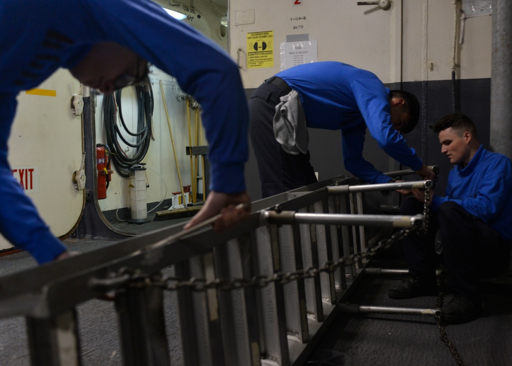 Nimitz Sailors Work on Ladder