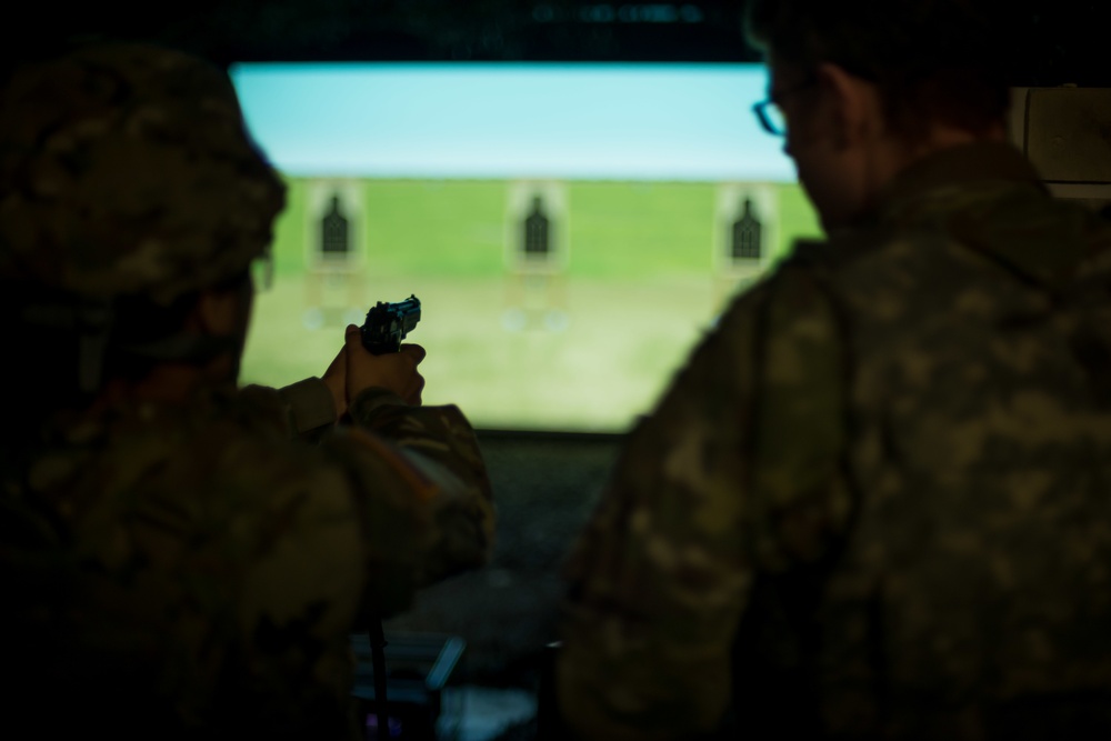Dental Clinic Soldiers Practice Firing at the Engagement Skills Trainer