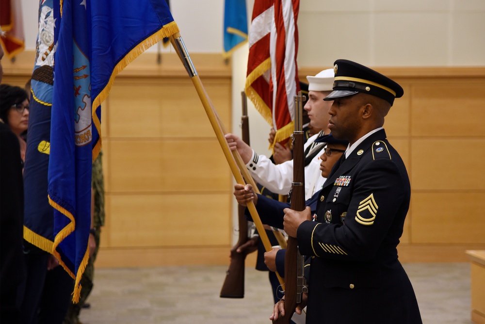 Joint-service flag detail presents the colors during Memorial Day ceremony.