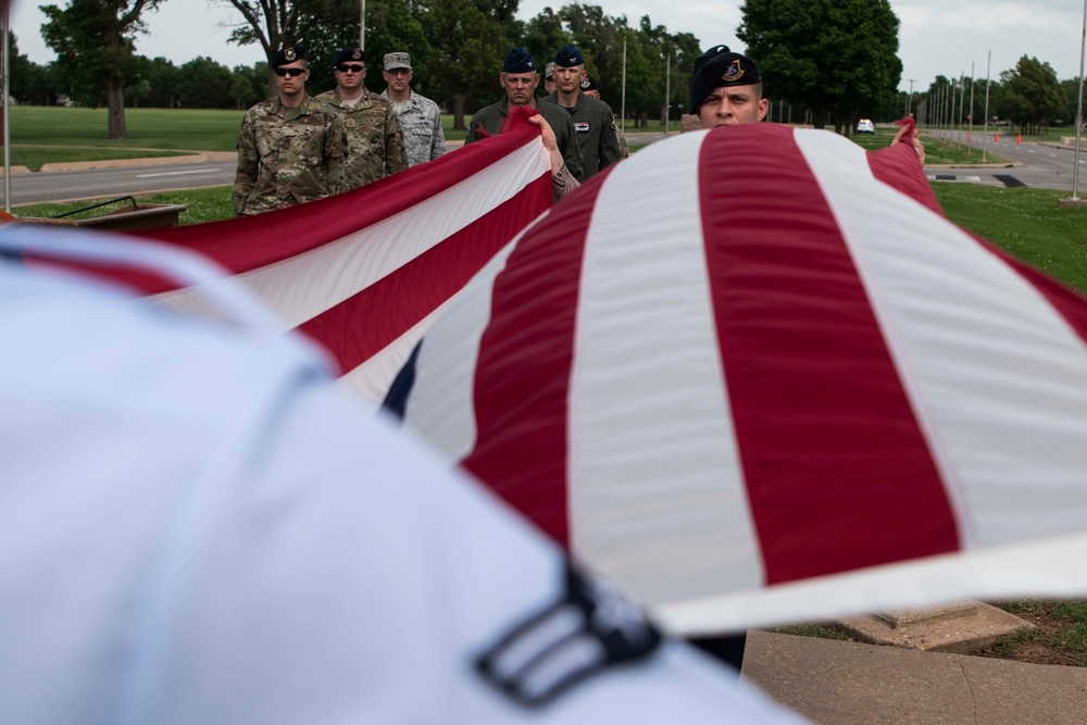 Airmen fold the American flag