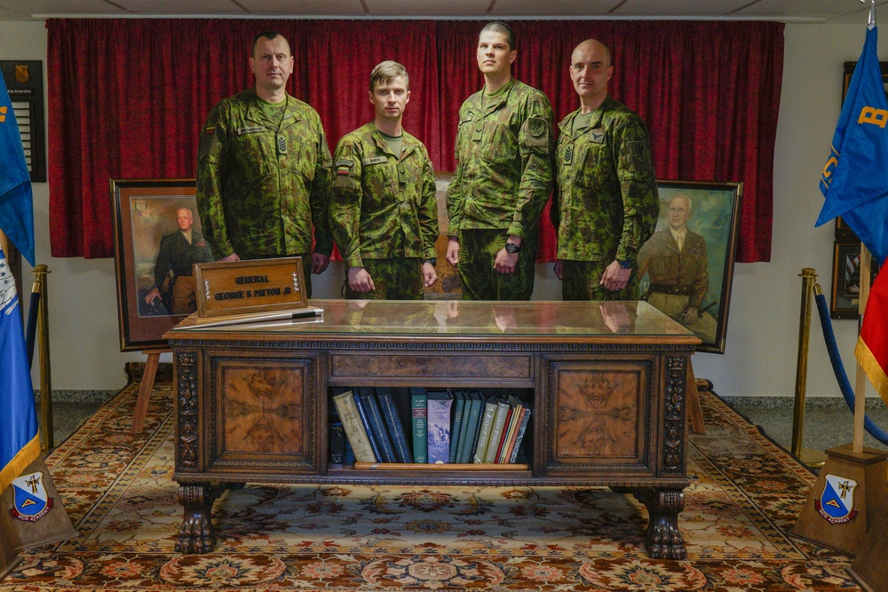 Lithuanian soldiers stand behind Gen. Patton’s desk