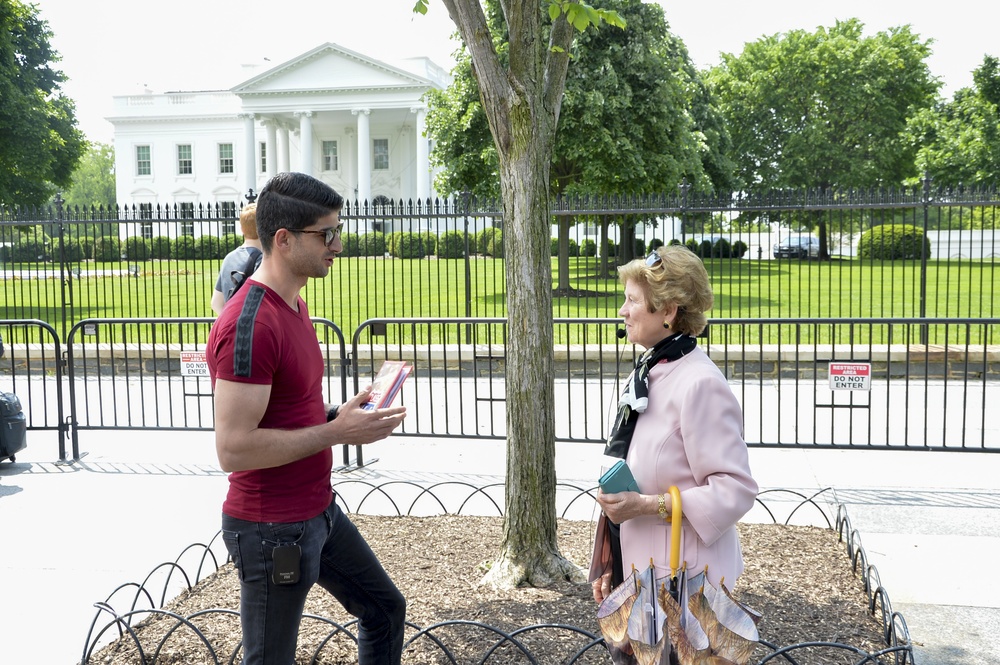 IMSO SMC Class 69 student gives a memento to the docent in Washington DC