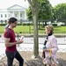 IMSO SMC Class 69 student gives a memento to the docent in Washington DC