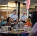 Service members volunteer to serve meals to seniors at Carter Burden Center for the Aging