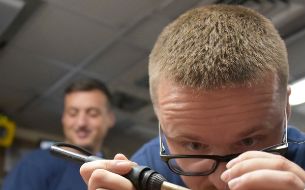 Coast Guard Cutter Thetis crew fixes equipment in the Gulf of Guinea