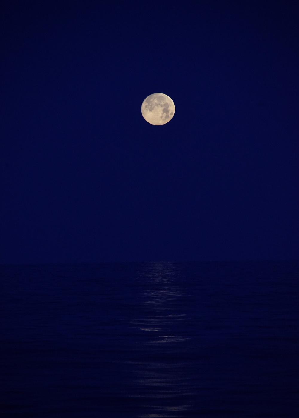 Sunrise, moonset during Coast Guard Cutter Thetis transits Mid-Atlantic Ocean