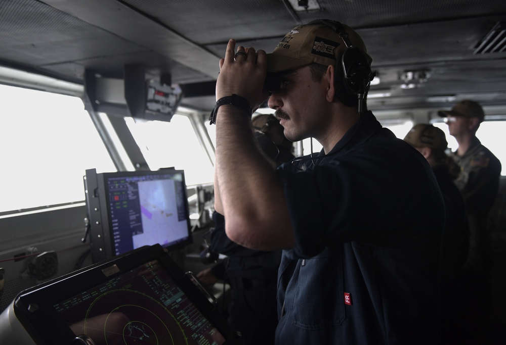 Sailor Stands Lookout At Sea