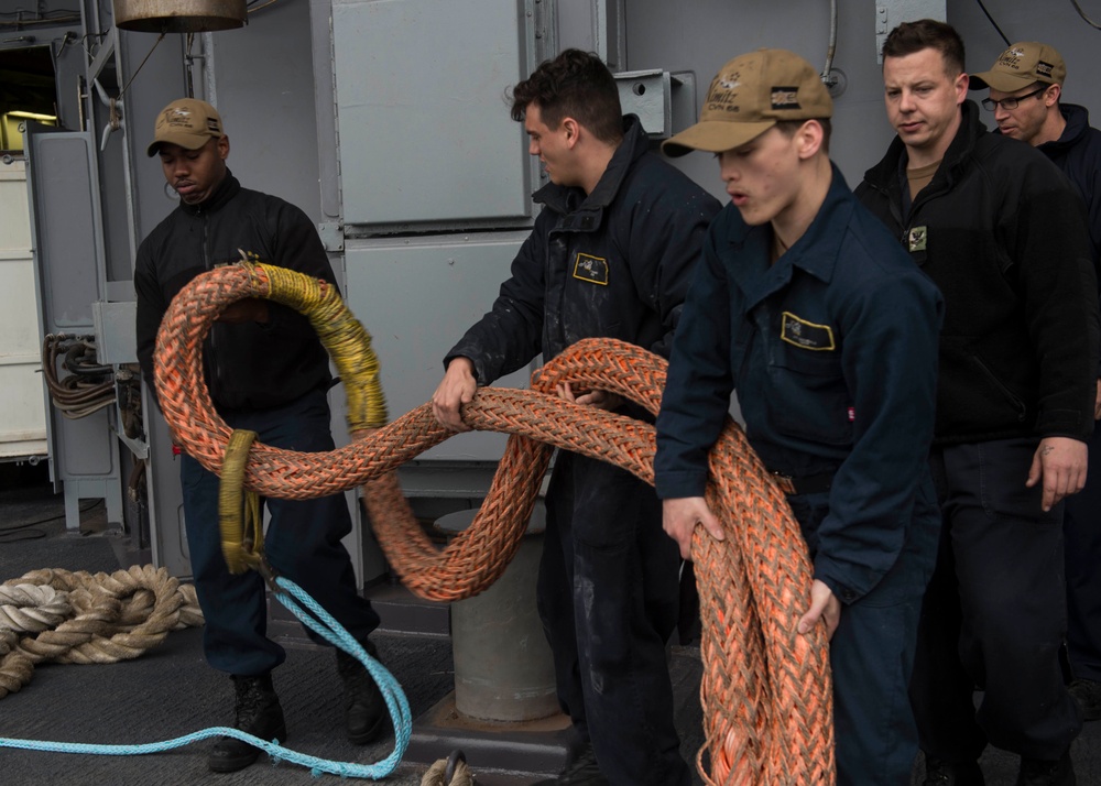 Nimitz Sailors Remove Tow Line