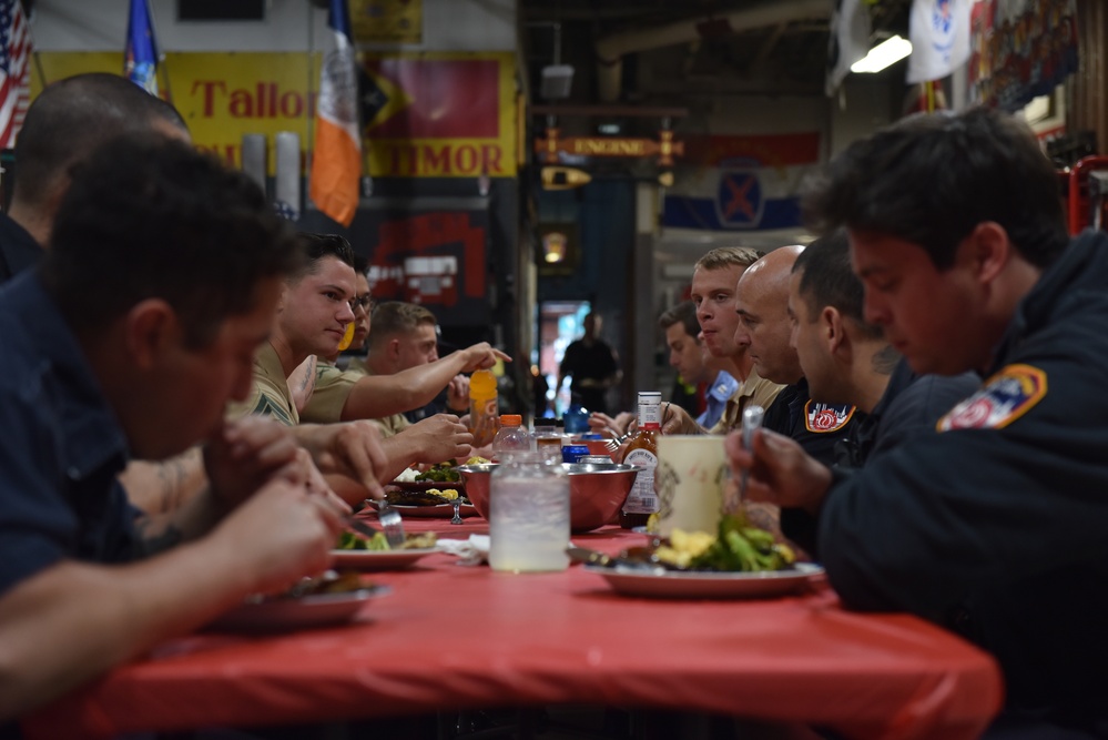 U.S. Marines Share A Meal With New York Firefighters