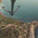 Bloody Hundredth flies over Normandy American Cemetery