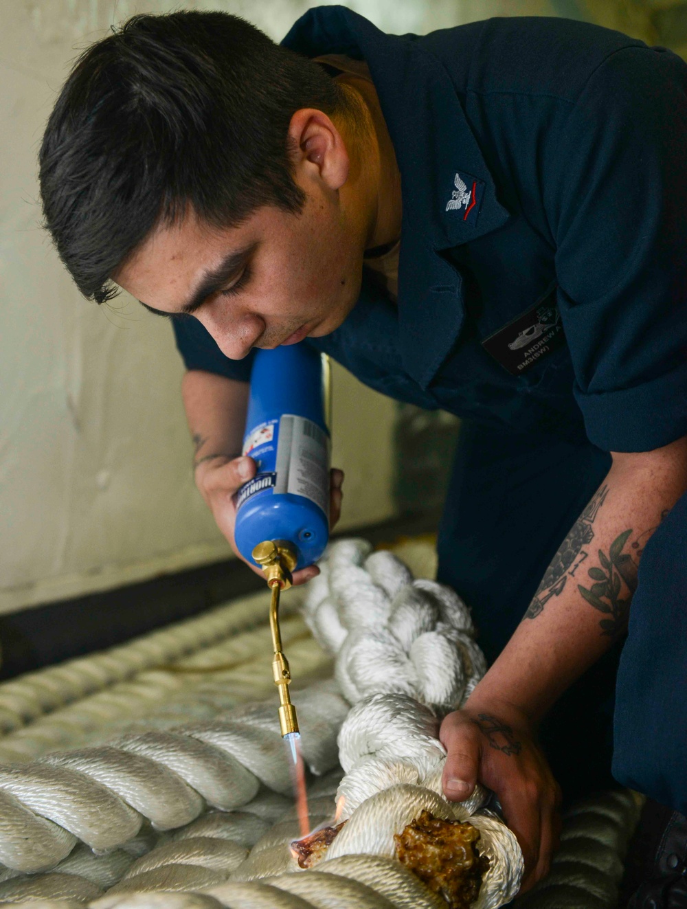 Nimitz Sailor Burns Mooring Line For Line Maintenance