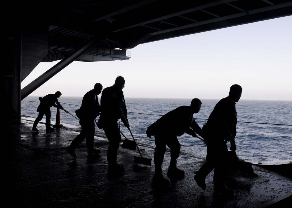 Nimitz Sailors Scrub Hangar Bay