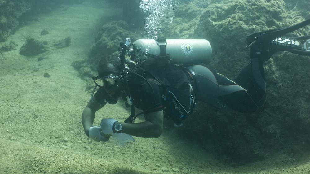 Okinawa divers clean the ocean floor at North Steps