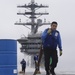 Nimitz Sailor Carries Hose