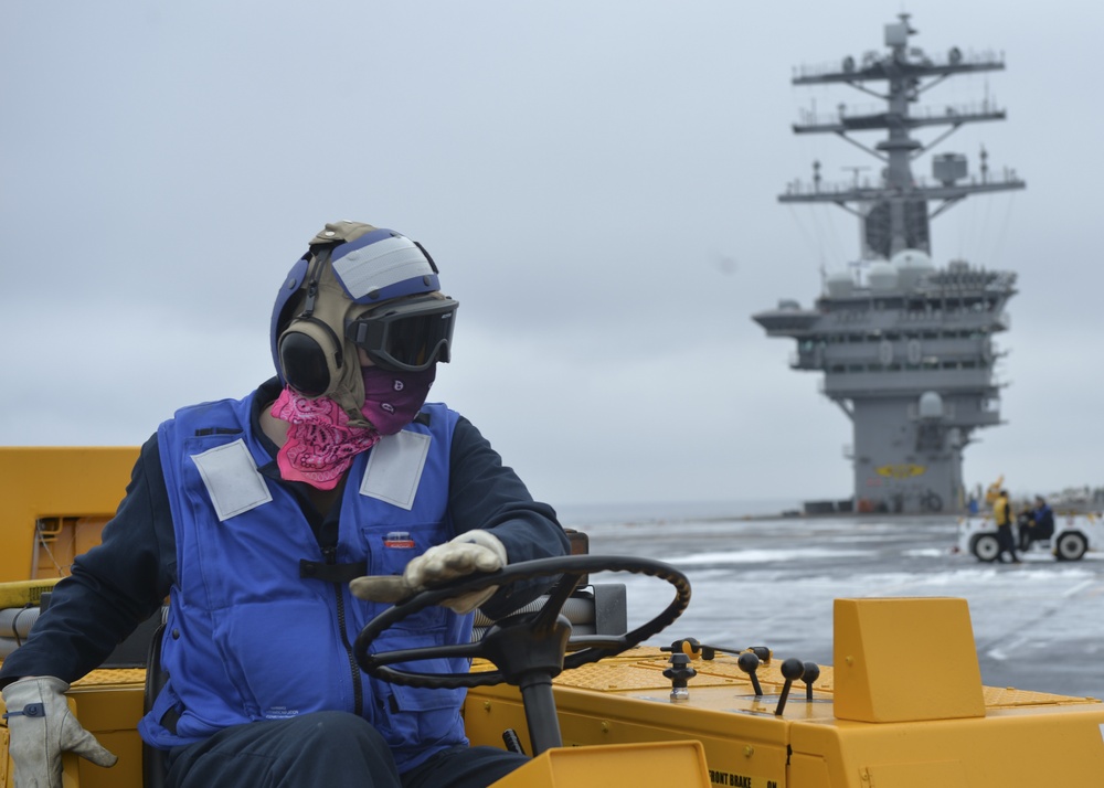 Nimitz Sailor Scrubs Flight Deck