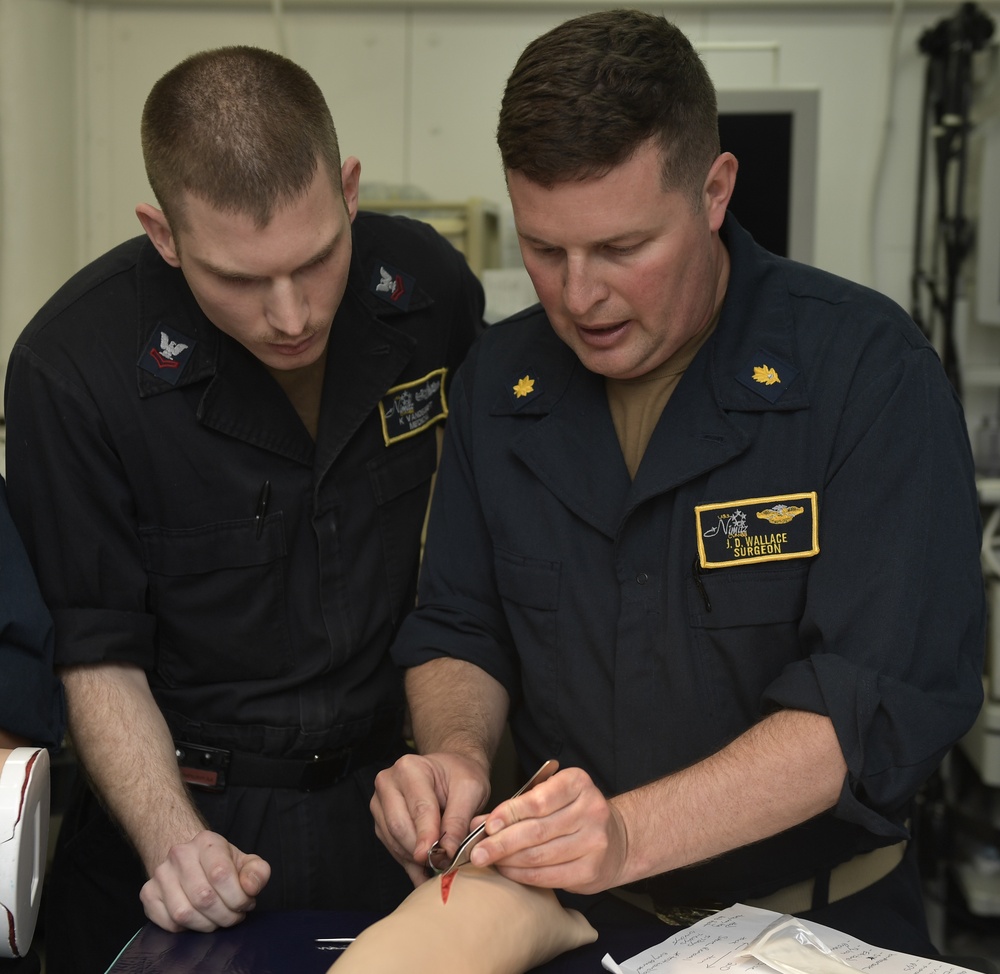 Nimitz Surgeon Trains Corpsman How To Suture