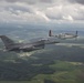 Scat VII, Robin Olds' P-51 Mustang, flies along Spangdahlem F-16C aircraft