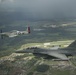 Scat VII, Robin Olds' P-51 Mustang, flies along Spangdahlem F-16C aircraft