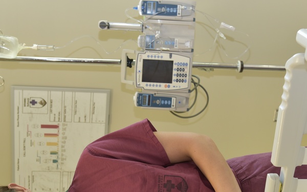 Hannah Sasscer, RN, poses in a PICU room