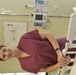 Hannah Sasscer, RN, poses in a PICU room