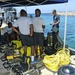 U.S. Navy Diver gives a predive safety brief to divers assigned to Mobile Diving and Salvage Unit, Company 22 (MDSU-22) and their counterparts in the Barbados coast guard