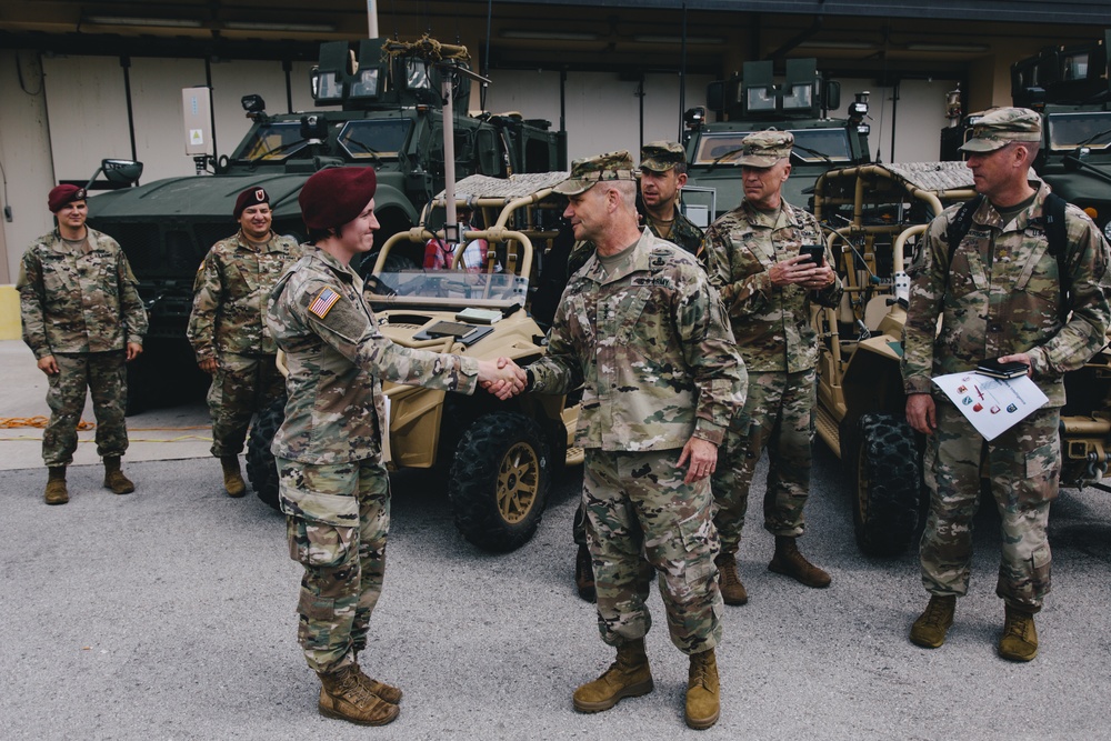 Lt. Gen. Christopher Cavoli greets paratroopers of the 173rd Airborne Brigade