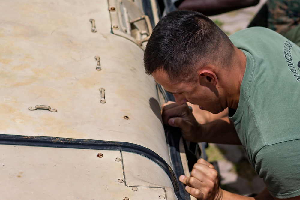 MAG-12 conducts Humvee push for 1st MAW warrior games