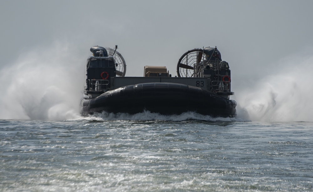 Landing Craft Air Cushion attached to Assault Craft Unit 4 Pulls Into Well Deck of USS New York