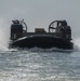 Landing Craft Air Cushion attached to Assault Craft Unit 4 Pulls Into Well Deck of USS New York
