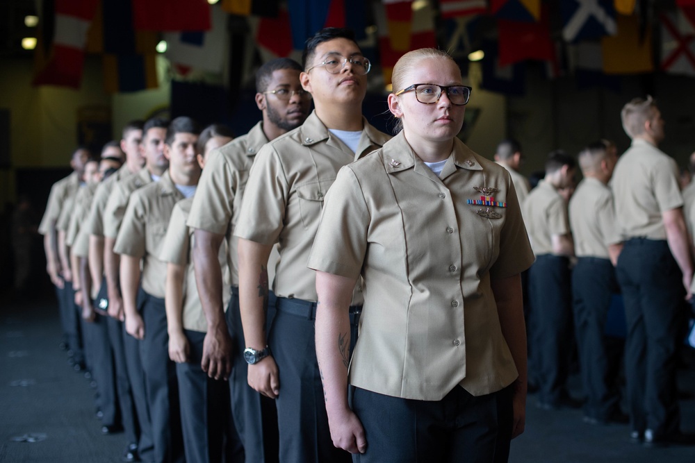 The aircraft carrier USS John C. Stennis (CVN 74) holds a promotion ceremony