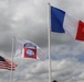 French, U.S. and 82nd Airborne Division flag is flown in Ste. Mere Eglise