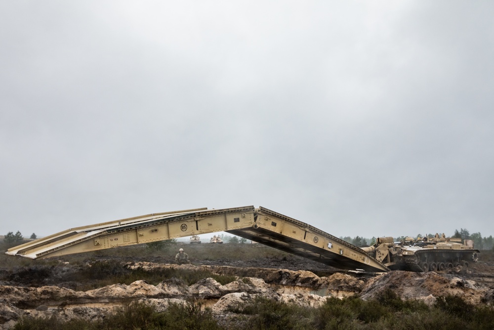 1st Engineer Soldiers Moving Across Bridges