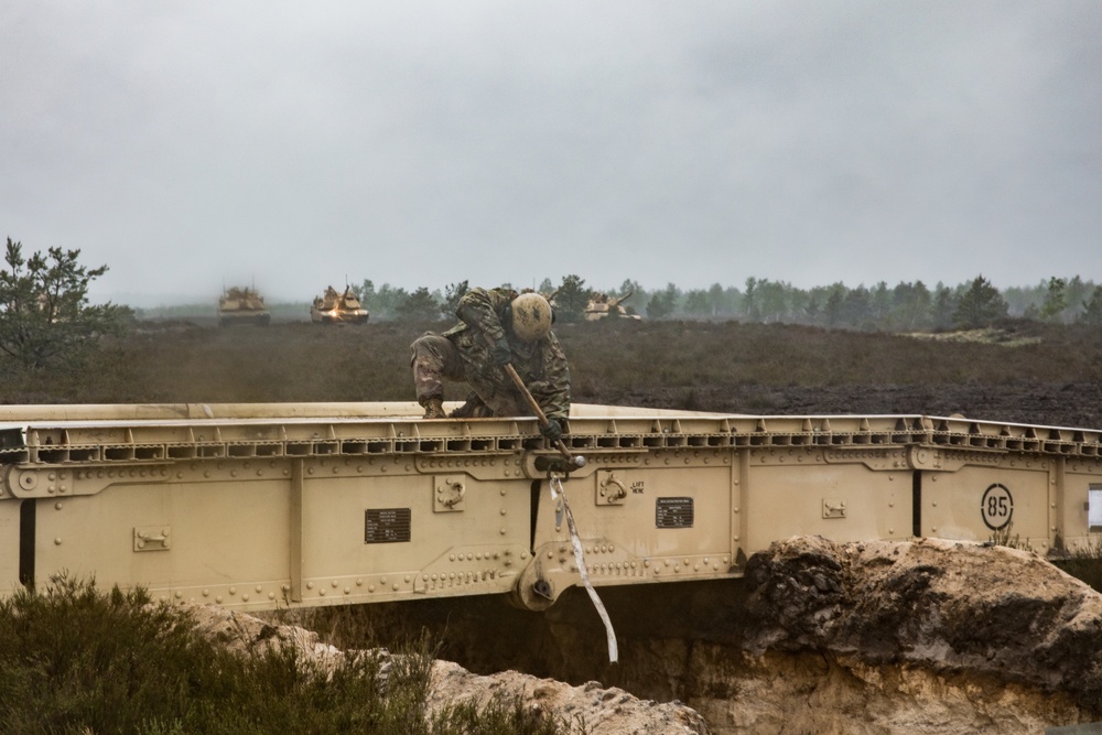 1st Engineer Soldiers Moving Across Bridges