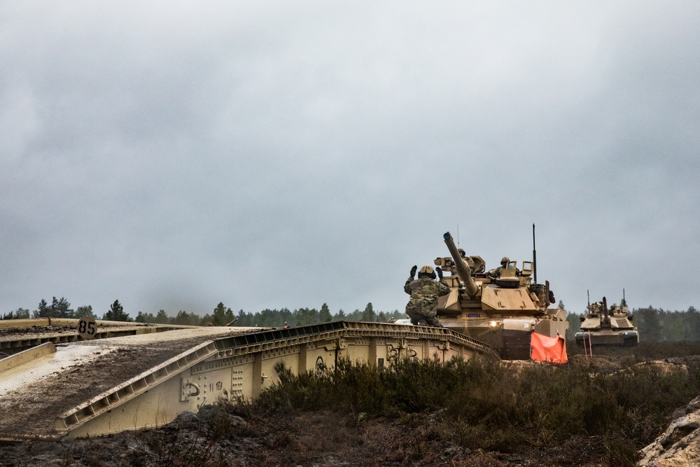 1st Engineer Soldiers Moving Across Bridges