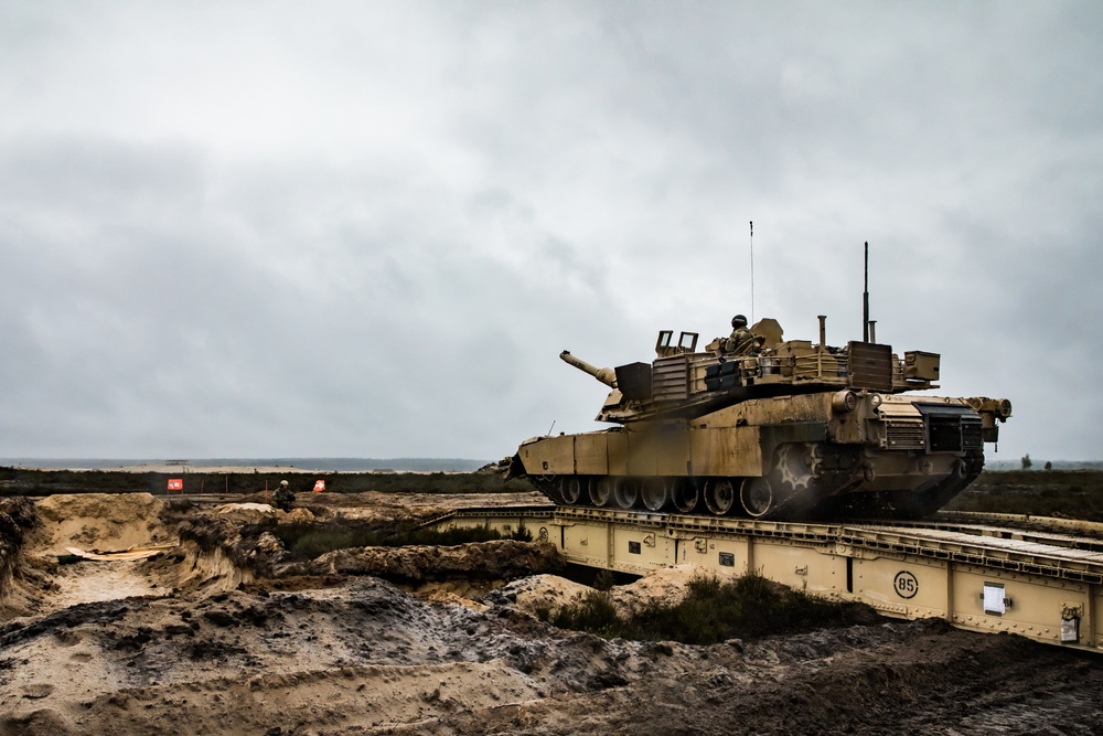 1st Engineer Soldiers Moving Across Bridges