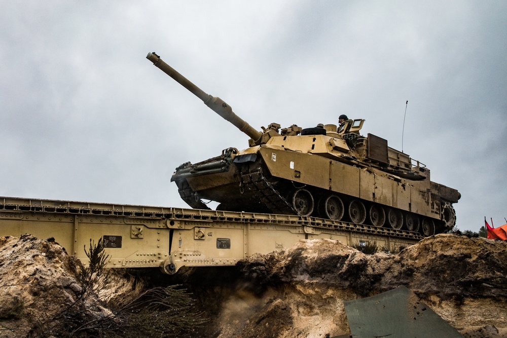 1st Engineer Soldiers Moving Across Bridges