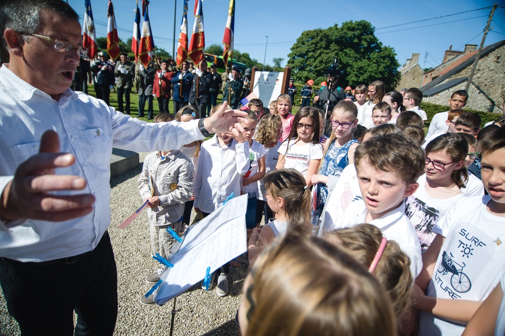 French children sing during memorial ceremony