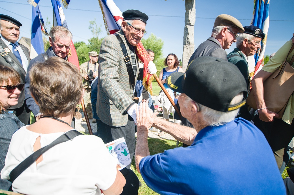 Participants greet World War II veterans