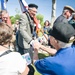 Participants greet World War II veterans