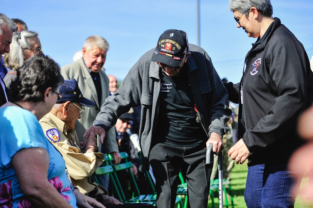 World War II veterans take seats before ceremony