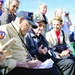 World War II veterans sign autographs