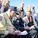 World War II veteran signs autograph